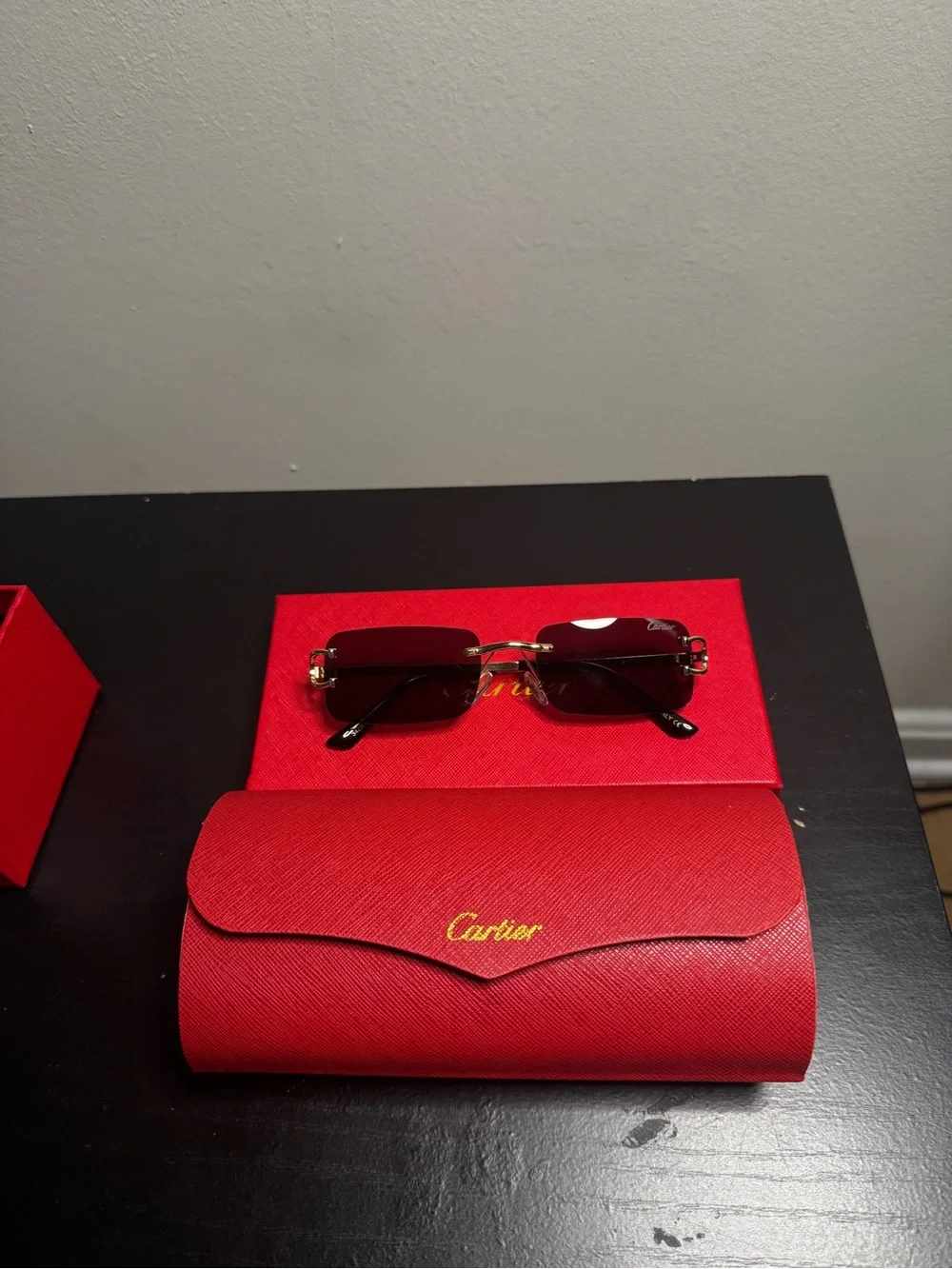 Cartier Women's Rimless Sunglasses with Burgundy Lenses and Gold Accents